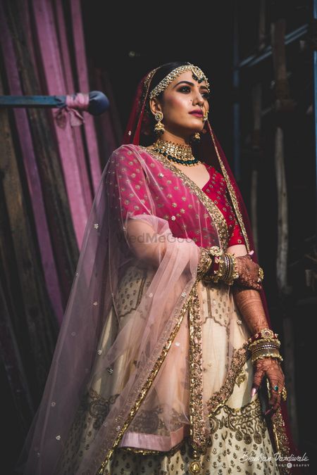 Photo of A bride in red and white lehenga