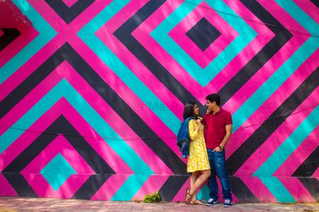 Photo of Pre wedding shoot infront of striped wall