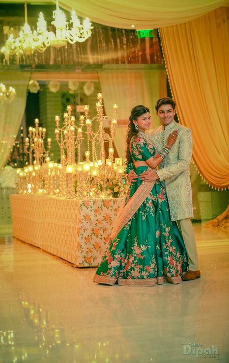 Photo of Couple Portrait with Candle Stands and Chandelier