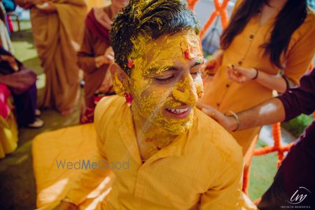 A smiling groom on his Haldi.