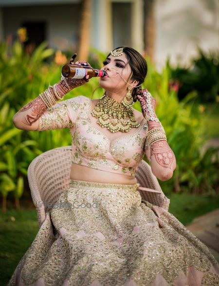 Bride with alcohol bottle in her hand