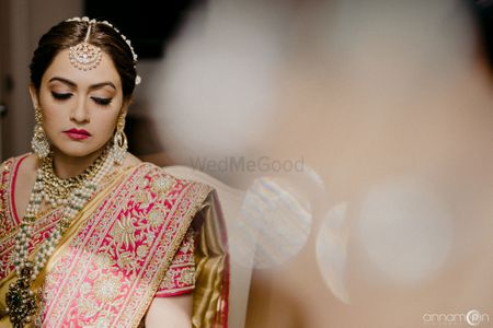 Wedding day bridal portrait with embroidered lehenga and pearl jewellery