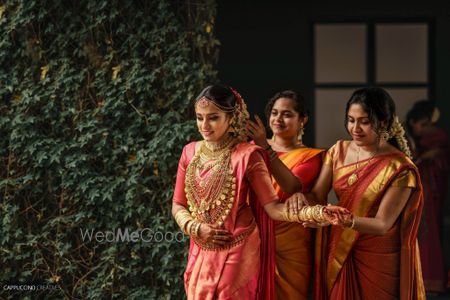 Photo of A south Indian bride getting ready with her bridesmaids