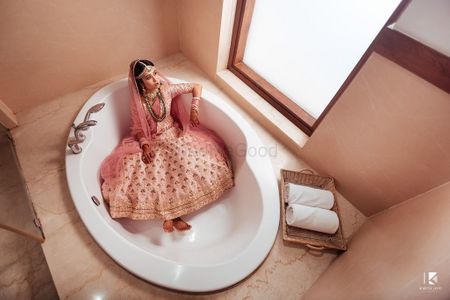 Photo of Bridal getting ready shot in bathtub