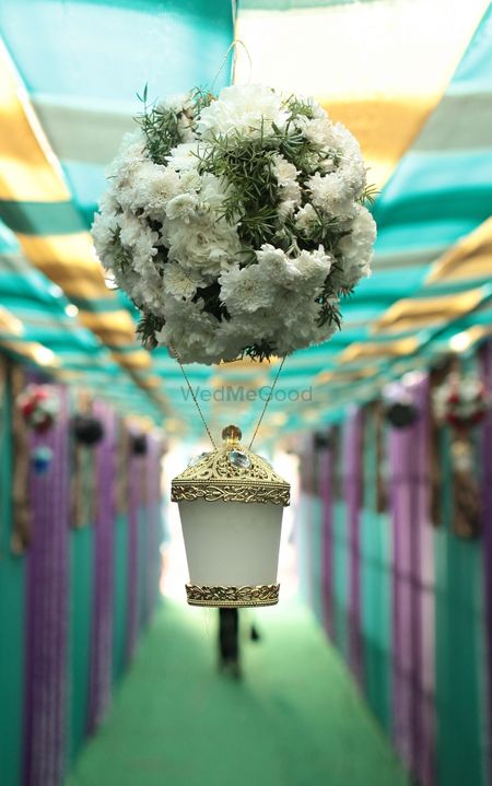 Photo of Hanging White and Gold Floral Decor