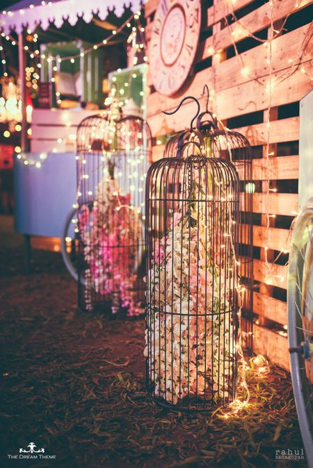 Giant birdcage with flowers inside 