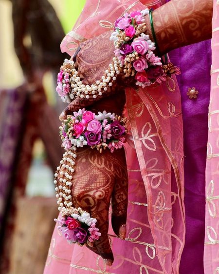 A combination of floral and beaded haathphool