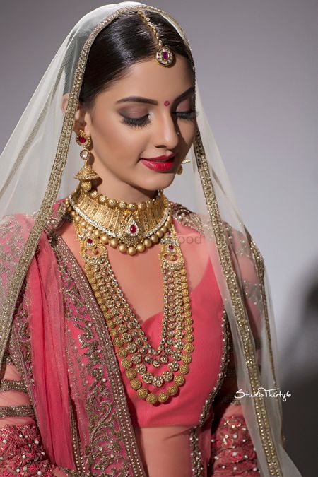 Simple bridal look with matte brown eyes and red lips