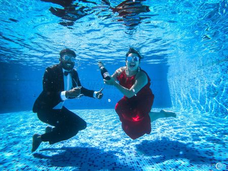 Cute pre wedding shoot photo idea underwater with champagne