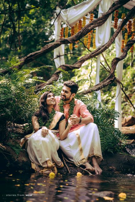 Photo of A south Indian couple wearing a unique, leafy jaimala