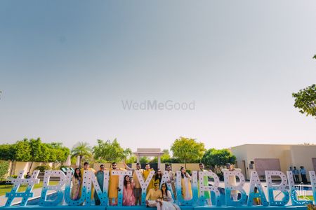 Giant wedding hashtag photobooth idea for pool party or mehendi