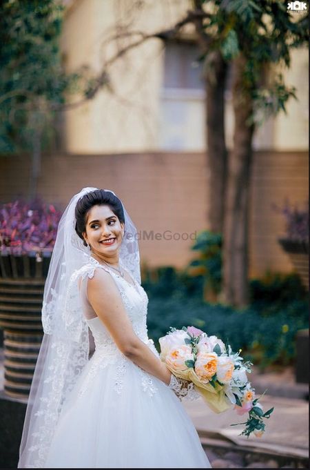 White Net Wedding Gown with Floral Bouquet