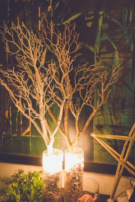 Dim Light Candles with Dry Trees Decor