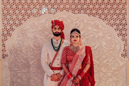 An adorable couple on their wedding in stunning outfits. 