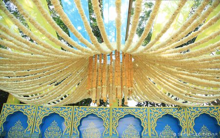 Floral mandap decor idea with hanging floral strings 