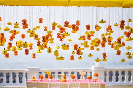 Photo of Yellow and orange hanging floral string decor idea