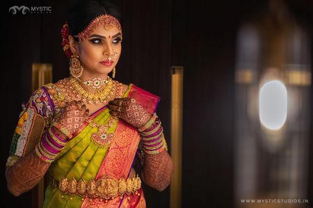 South indian bridal look with gold waistbelt and necklaces 