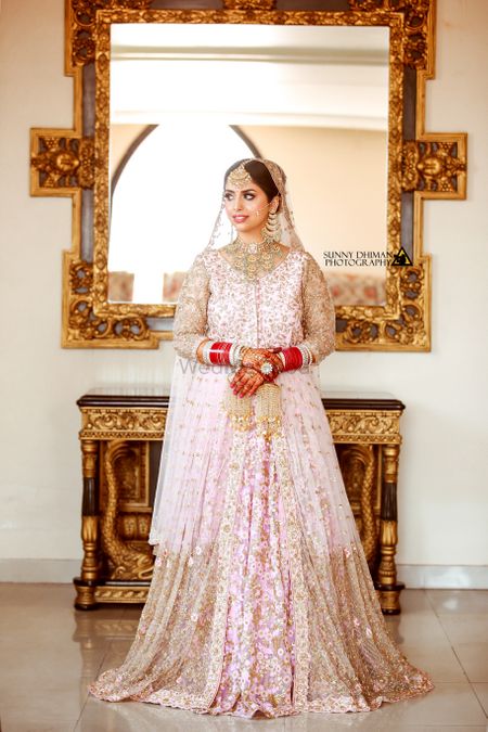 Sikh bride in light pink with jacket lehenga