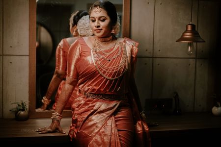 A south Indian bride in a kanjeevaram and gold jewellery