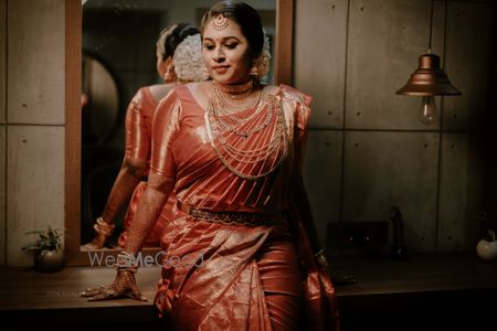 A south Indian bride in a kanjeevaram and gold jewellery