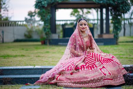 Red bridal lehenga with single dupatta drape in lighter colour