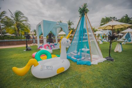 Photo of Pool party decor idea with teepee and floatie
