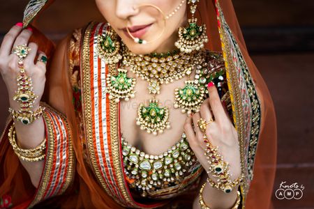 Layered polki and enamel necklaces in green for bridal look