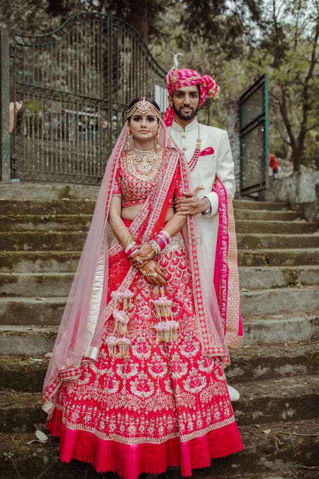 A beautiful couple portrait in color-coordinated outfits on their wedding. 