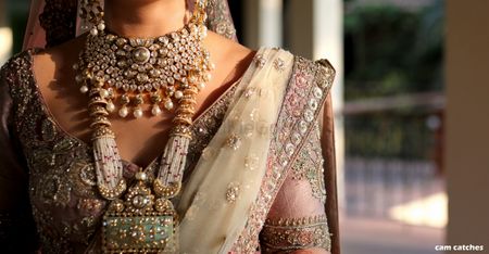 Photo of Layered bridal necklace and embroidered sleeves
