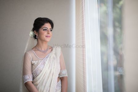 Photo of Subtle bridal look in white lace saree