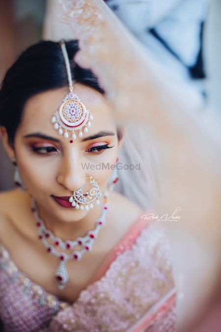 Matching bridal nath and maangtikka with ruby and diamond necklace