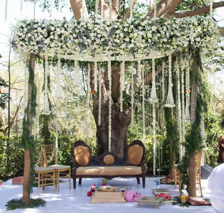 An open mandap with white floral strings