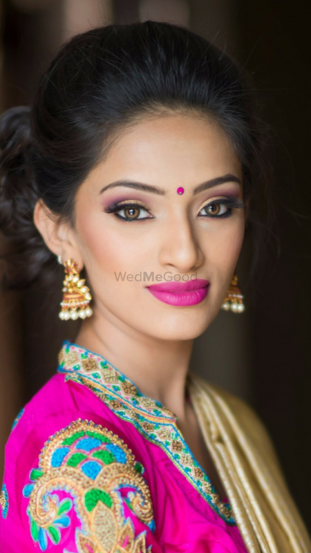 Indian girl wearing bindi and fuschia lipstick
