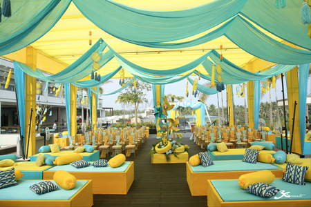 Yellow and blue tent decor for a day mehndi cermeony 