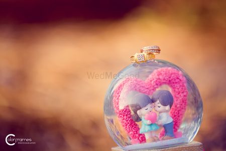 Engagement Ring on Cute Snow Globe with Couple