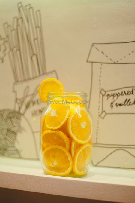 Yellow table centerpieces with oranges