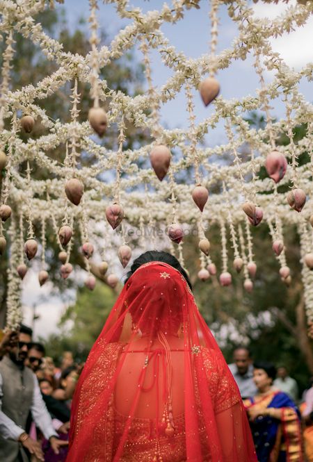 Bride under lotus phoolon ki chadar