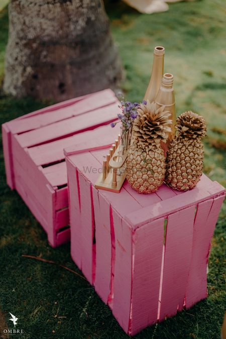 DIY gold painted pineapple centrepiece idea on crates