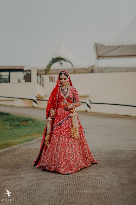 gold and red embroidered bridal lehenga with kaleere