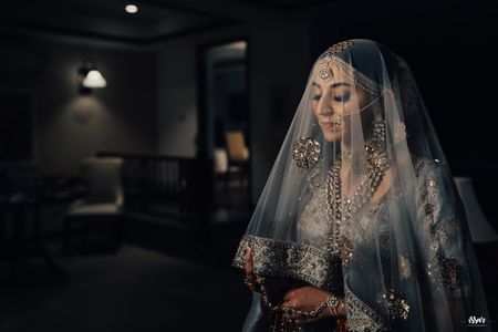bride in offbeat lehenga and dupatta as veil