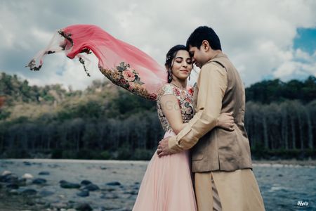 romantic couple shot on mehendi with flying floral dupatta