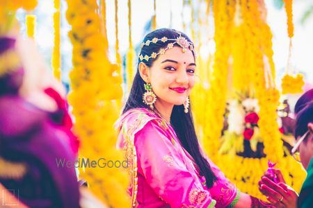 Bride wearing gota jewellery on mehendi