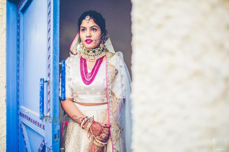 Photo of Layered pink necklace with off white bridal lehenga