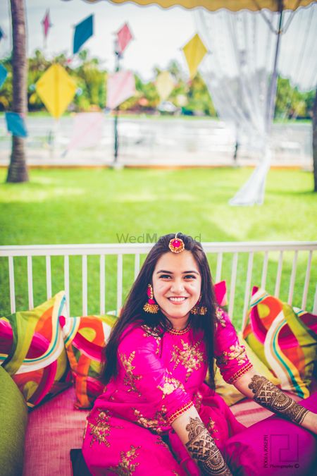 Bride on mehendi day in pink outfit