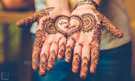 Photo of Half and Half Spaced out Mehendi Design with Names