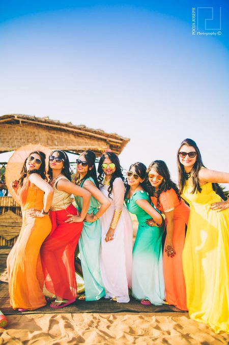 Photo of Fun Colourful Bridesmaids Photo at Beach Wedding