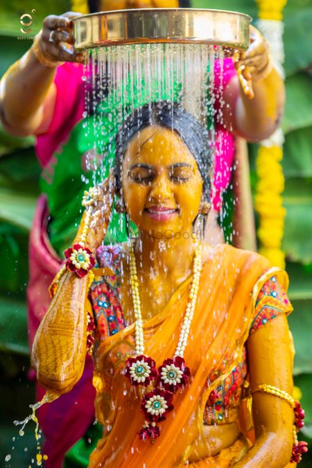 Photo of A south Indian bride on her mehndi in yellow saree