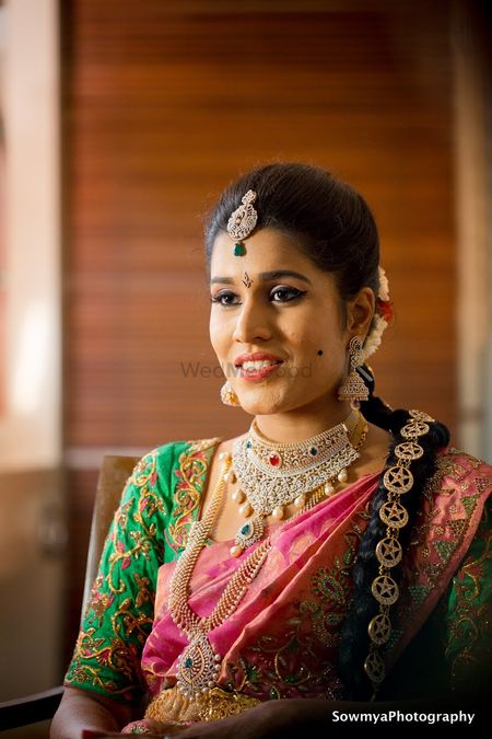 A south Indian bride in a saree with stunning gold and diamond jewellery 