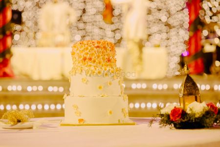 Photo of White Cream 3 Tier Wedding Cake with Gold Decor