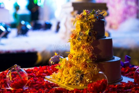 Photo of Cream Fondant 3 Tier Wedding Cake with Floral Decor